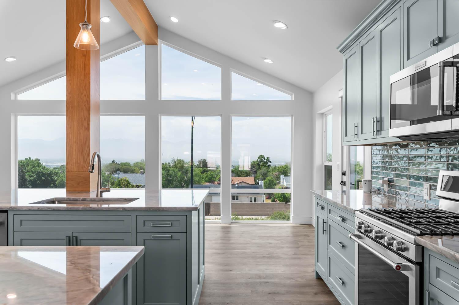 Whole-home remodel with vaulted ceiling, exposed wood beam, and a mountain valley view